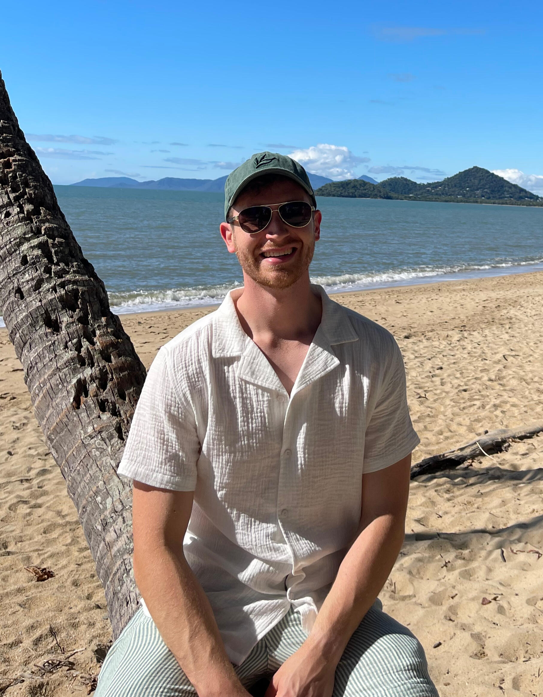 A picture of the founder in a beach-like setting